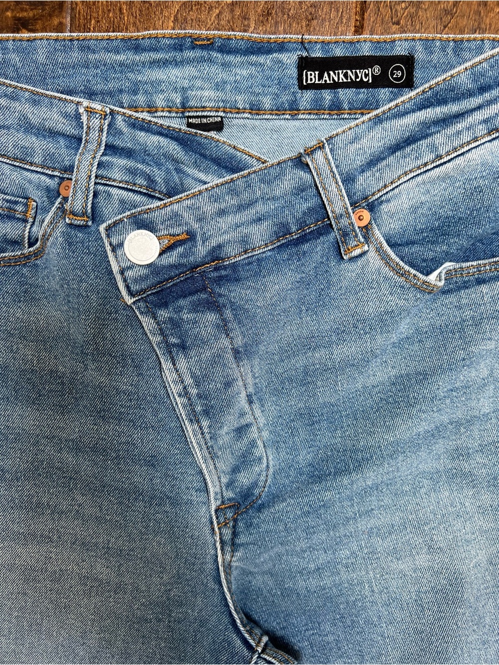 Blank NYC Women’s Faded Blue Straight Crop Asymmetrical Button Jeans